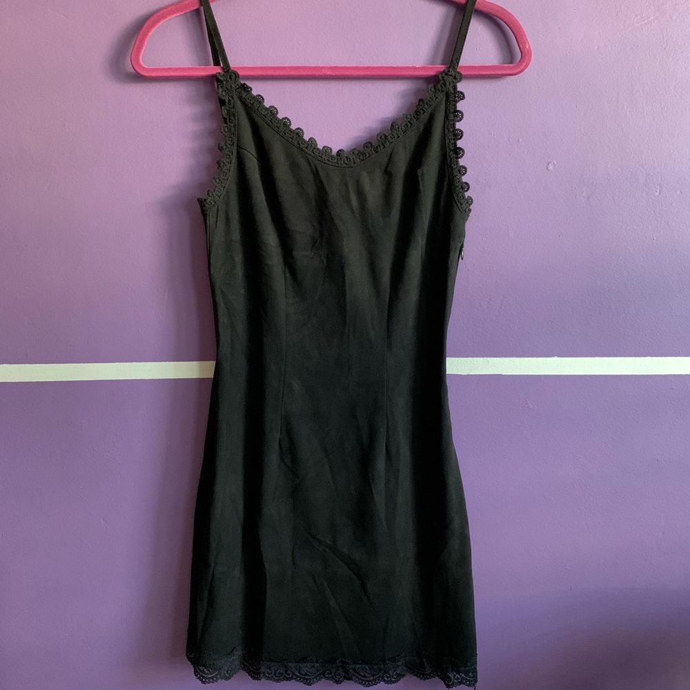 Little black velvet dress with lace trimmings.
